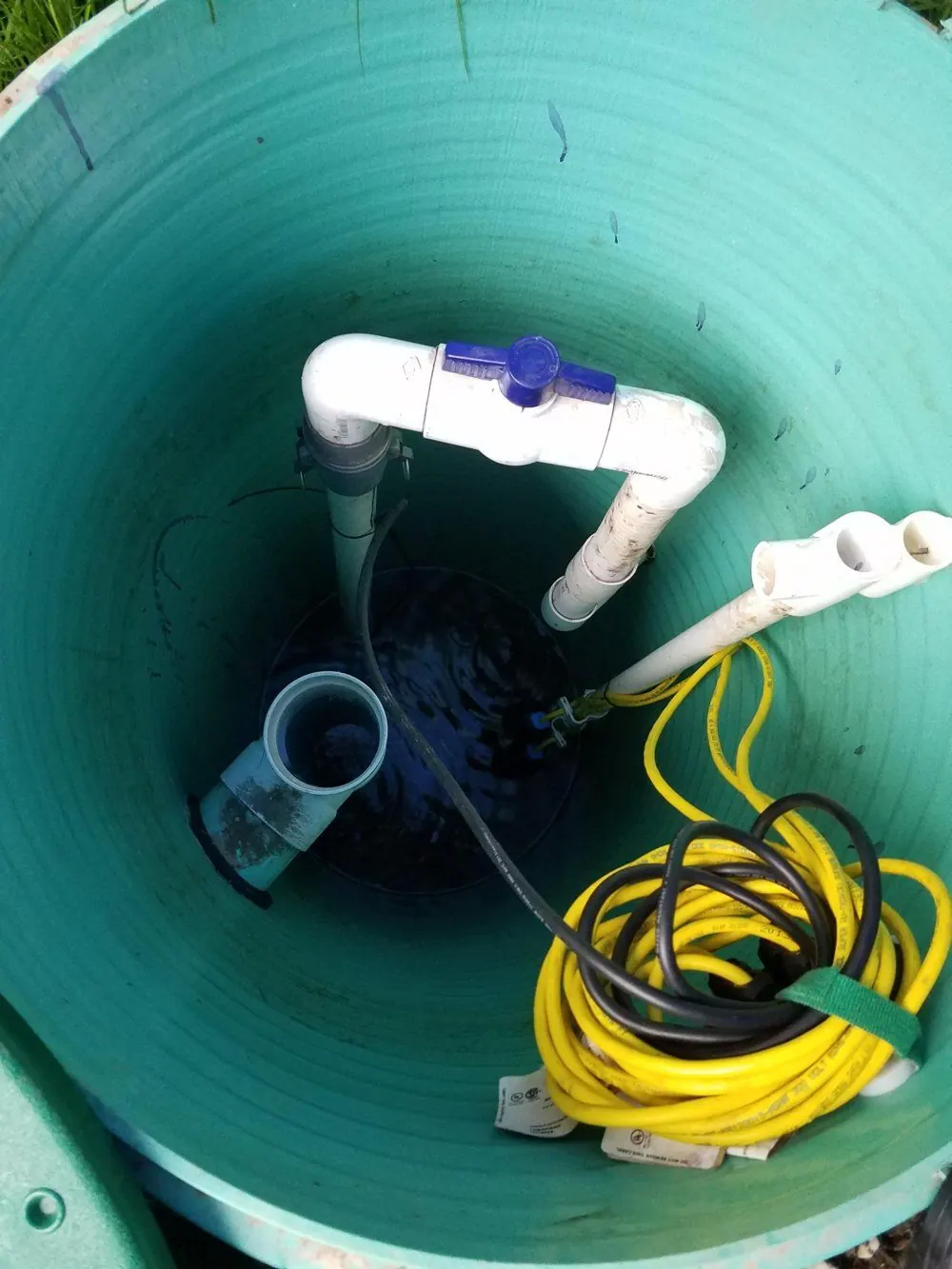 Accessible septic pump chamber with discharge pipe and control cables